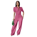 Detail shot of pink short sleeve jumpsuit showing lapel collar and single-breasted buttons - Pink