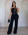 Dettaglio dei bottoni dorati in rilievo sul lato di una tuta nera senza spalline elegante - S / Nero