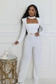 Detail of white wide-leg jumpsuit with cutout neckline and decorative gold chain belt - S / White