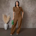 Close-up of deep brown one-piece jumpsuit with metal buttons and cargo pockets - Brown