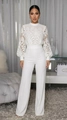 Detail shot of the elegant white lace top and high-waisted wide-leg trousers - S / White