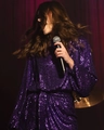 Detail of purple sequin dress showing shimmering texture and long sleeve design for parties - Deep purple