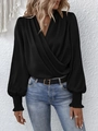 Detail of smocked cuffs on a black V-neck surplice blouse with elegant lantern sleeves - S / Black
