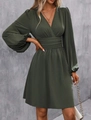 Detailed view of the dark green V-neck dress featuring lantern sleeves and pleated waist texture - S / Army Green