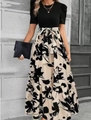 Detail of elegant black puff sleeves and floral print maxi skirt with bow tie waist - S / Khaki