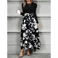Elegant long sleeve dress featuring a black fitted top and floral print A-line skirt - S / Black and White