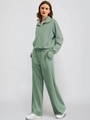 Detail view of sage green two-piece sweatshirt set with wide-leg pants and half-zip design - S / Green