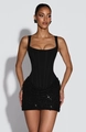 Detalle de corpiño tipo corsé con minifalda de lentejuelas en un vestido de fiesta negro - S / Vestidos / Negro