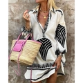 Detail of bohemian white mini dress featuring black leaf embroidery and lantern sleeves - S / Dresses / Black