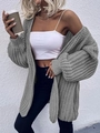 Detail of grey chunky knit cardigan showing heavy cable texture and puff sleeves - S / Light Gray