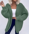Detailed close-up of dark green oversized knit cardigan with chunky stitch texture - Bean Green