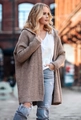 Close-up detail of coarse knit texture and ribbed cuffs on loose-fit hooded cardigan - S / Paris Apricot