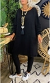 Detail of the chunky black knit texture and crew neckline on a loose oversized sweater - Black