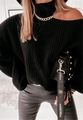 Detailed texture of black chunky knit sweater with cold shoulder and gold chain accessory - Black