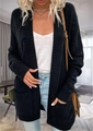 Detail of black cable knit cardigan showing thick texture and large side pockets on long sleeve - Black
