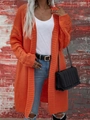 Dettaglio di un lungo cardigan in maglia arancione con trama a coste e motivi traforati - S / Arancione