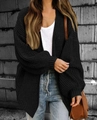 Detailed view of women's chunky knit black cardigan with lantern sleeves and oversized fit - Black
