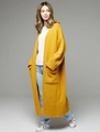 Detail shot of the mustard yellow knit cardigan with large pockets and ribbed cuffs - Bright Yellow