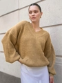 Close-up of mustard yellow V-neck knit sweater featuring oversized drop shoulder design - S / Camel