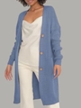 Detail of blue oversized knit cardigan featuring texture and brown buttons on the front - Light Blue