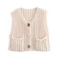 Close-up of knit vest details including V-neck, vintage buttons and small patch pockets - Off White