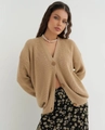 Detail of khaki knit cardigan showing V-neckline and textured wooden buttons closely - S / Tops / Khaki