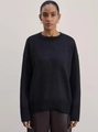 Detail of loose fit dark grey round neck knit sweater with dropped shoulder seams - M / Black