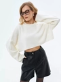 Detail of a white cropped knit sweater with crew neck and long drop-shoulder sleeves - White