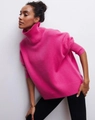 Women's loose turtleneck knit sweater in vibrant rose red with ribbed cuffs and hem - S / Rose Red