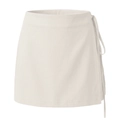 Detail of high-waist cream wrap skort showing twill texture and side tie-up closure - White