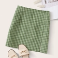 Mini green plaid skirt with high waist design and side slit in flat lay fashion style - L / Green