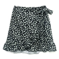 Detalle de falda de leopardo de talle alto con lazo lateral y borde de volantes - S / Leopardo Negro