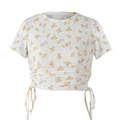 Macro detail of white floral T-shirt fabric featuring drawstring side and ribbed texture - S / White Yellow Floral