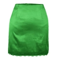 Detail of high waist bright green satin skirt featuring delicate lace hem and silky texture - S / Green