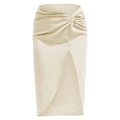 Detail of elegant satin skirt featuring French knot design and high front slit detail - Beige