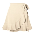 Detailed close-up of beige wrap skirt featuring ruffled hem and textured fabric finish - Beige