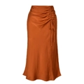 Detail view of caramel satin midi skirt showing ruched drawstring side and smooth texture - S / Orange Red