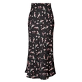 Close-up of black satin high-waisted skirt featuring delicate pink floral prints and side slit - Black Avocado Print