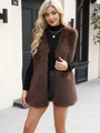 Outdoor street style view of a plush brown faux fur vest with premium glossy texture - Coffee