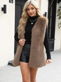 Detailed view of the brown faux fur vest texture during a high-end street fashion shoot - Light Khaki