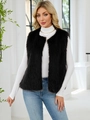 Women's faux fur long vest in black paired with white turtleneck and denim jeans - Black