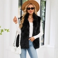 Women's black faux fur vest with long thick pile, worn with a white long-sleeved top - S / Black