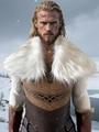 Detail of Viking chest armor with Celtic knot patterns and faux fur collar in snow - Snow Fox White Mix