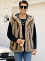 Detailed close-up of brown faux fur vest texture with hood and soft inner lining - Camel-threaded