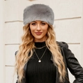Detail of grey faux fur winter headband worn by a model in a trendy outdoor outfit - Long Fur / Gray
