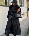 Detail of long black faux fox fur coat with a wide leather belt and oversized lapels - S / Black