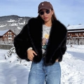 Short black faux fur jacket with wide lapels and fluffy texture worn in snow - S / Black