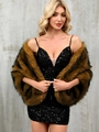 Elegant women's faux fur shawl in brown and black paired with a sequined black dress - Yellow-threaded