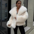 Short faux fox fur coat in creamy white featuring oversized lapels and fluffy cuffs - S / White