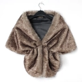Detail of faux fur shawl with plush brown texture and black satin lining on hanger - Brown Hare Color